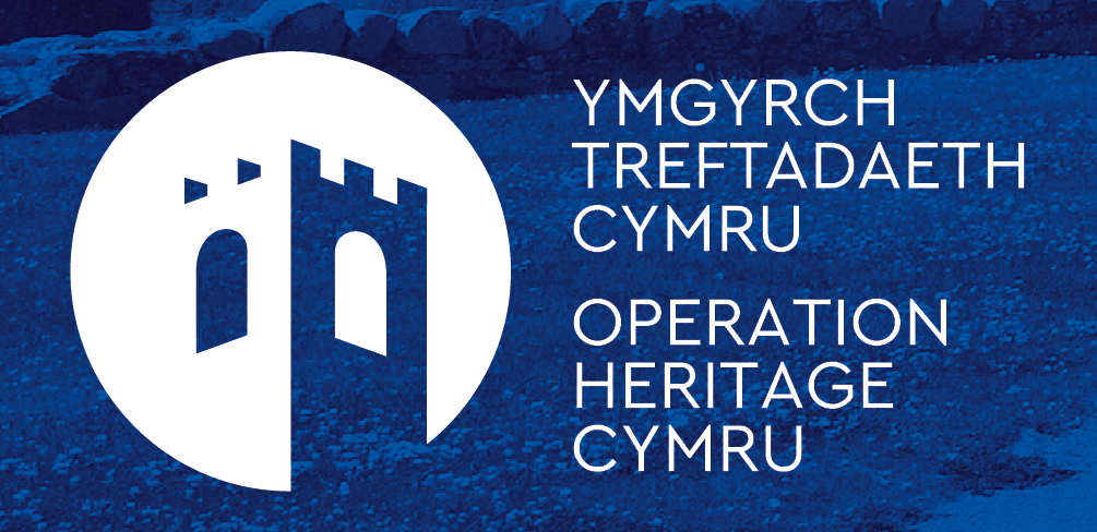 The logo of Operation Heritage Cymru, includes the text and an image of a castle.